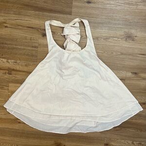 Elegant Homemade Cream Sleeveless Top with Long Ruffle Down the Back.